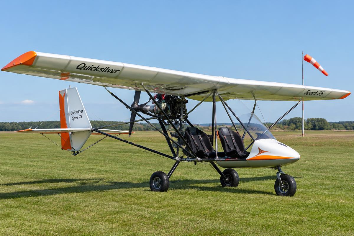 Quicksilver Sport 2S ultralight aircraft on a sunny grass runway