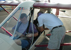 Two pilots walking around a Challenger aircraft during a sales demo